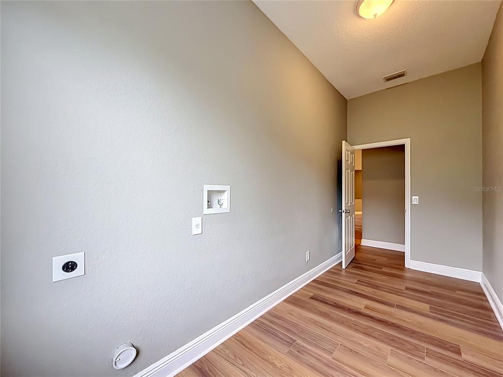 28549 Shirley Shores Road Tavares, FL 32778 - Photo 52 of 65 a view of a livingroom with wooden floor