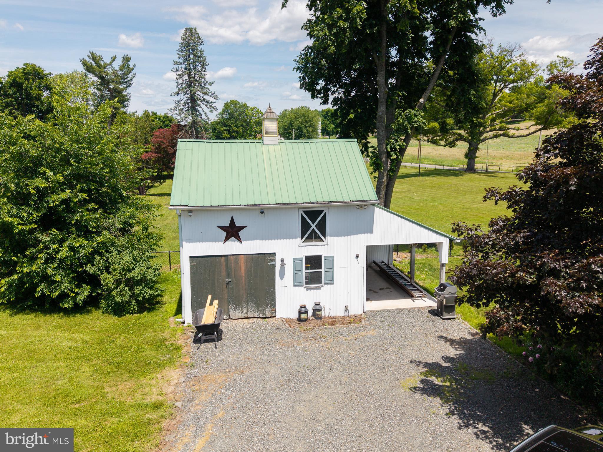 225 Niantic Road Barto, PA 19504 - Photo 66 of 82 an aerial view of a house with a yard table and chairs