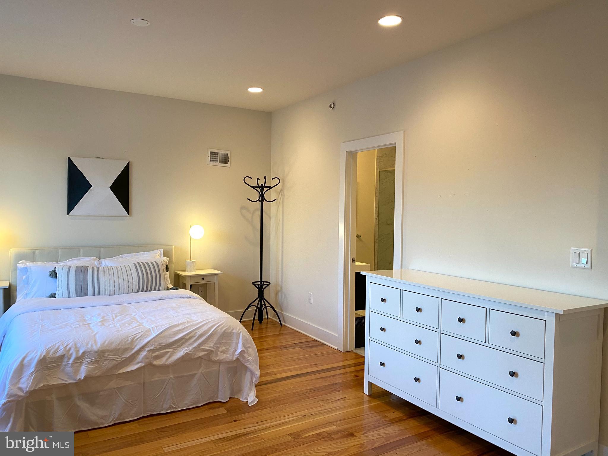 3304 Conrad Street Philadelphia, PA 19129 - Photo 13 of 29 a bedroom with a bed and a dresser