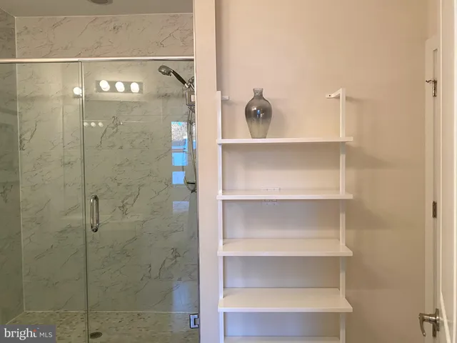 a en suite bathroom with a sink and a mirror