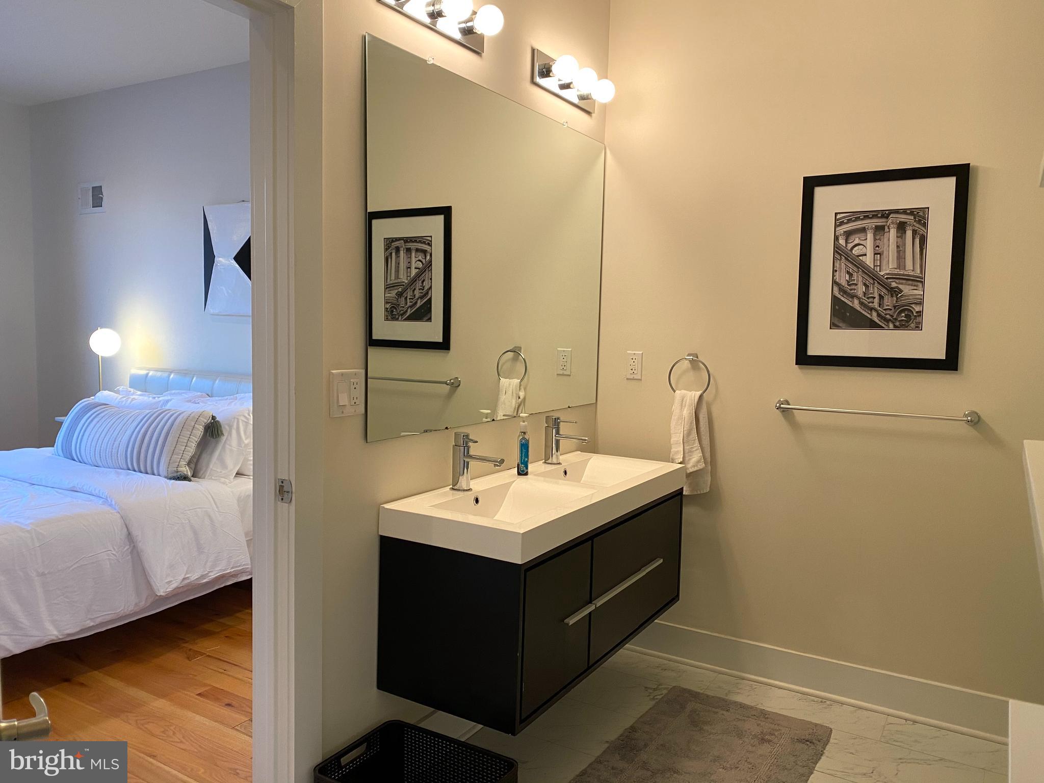 3304 Conrad Street Philadelphia, PA 19129 - Photo 15 of 29 a en suite bathroom with a sink and a mirror