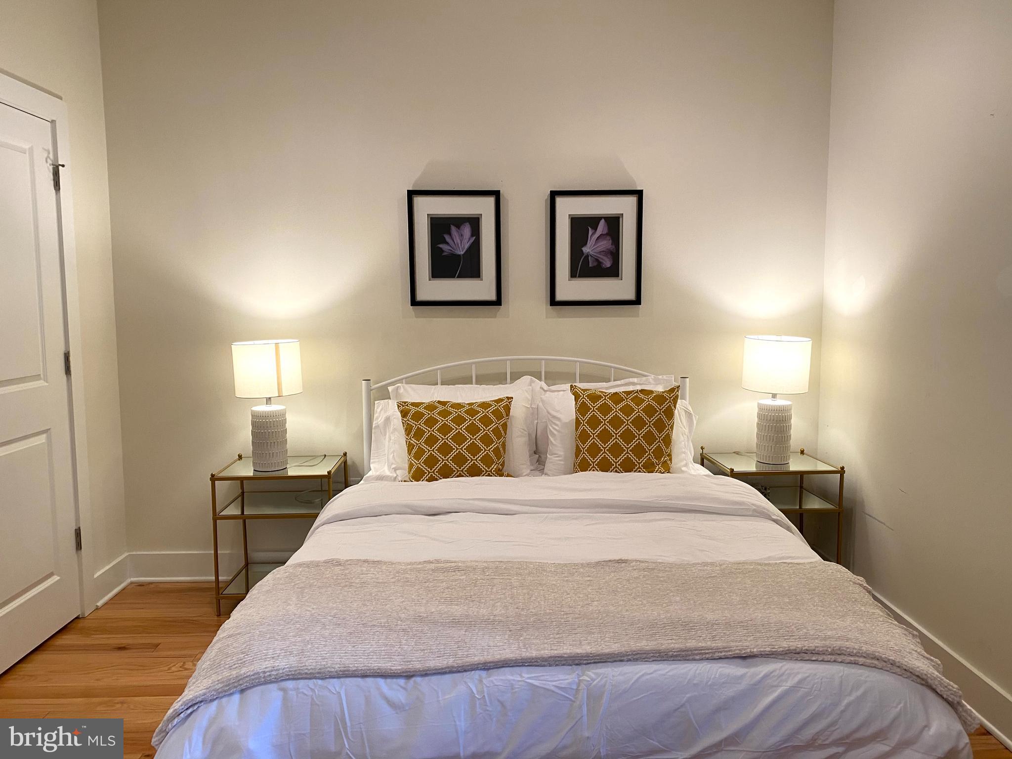 3304 Conrad Street Philadelphia, PA 19129 - Photo 21 of 29 a bedroom with a bed and a lamp