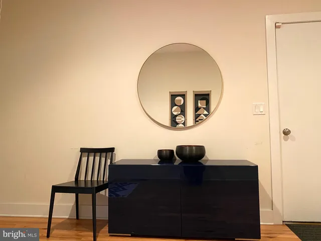 a bed room with a bed and a chair