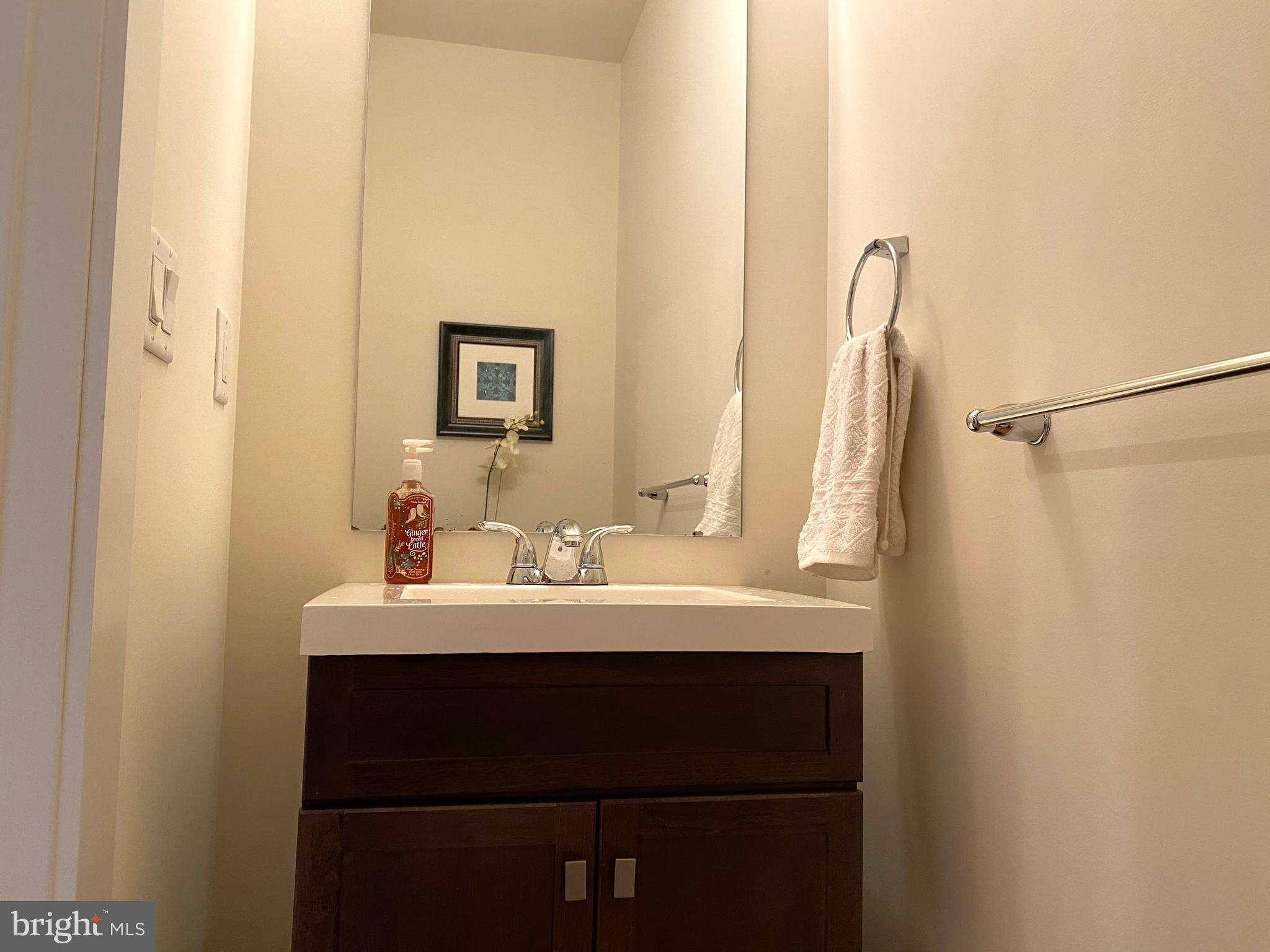 3304 Conrad Street Philadelphia, PA 19129 - Photo 25 of 29 a bathroom with a sink and a mirror