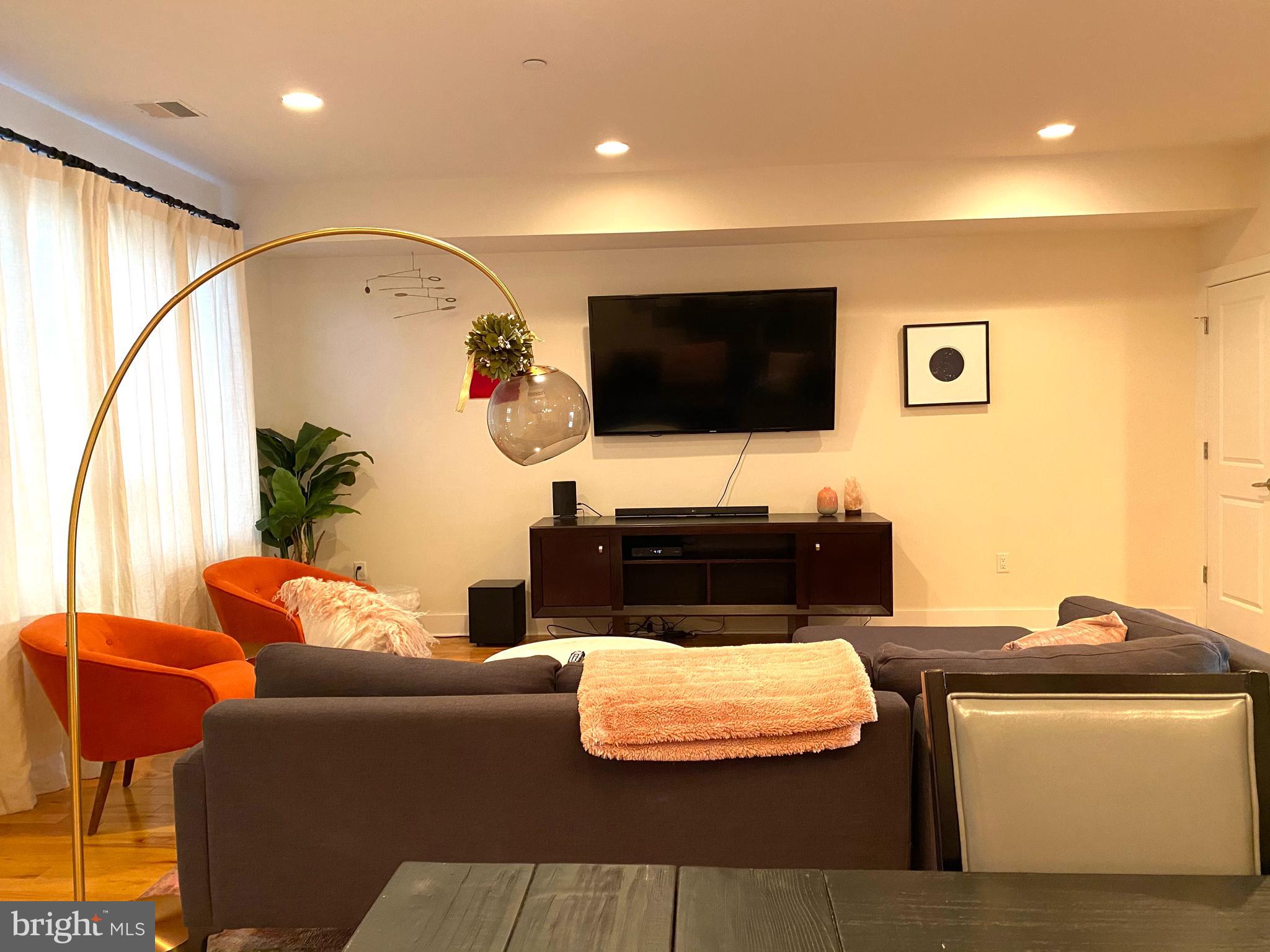 3304 Conrad Street Philadelphia, PA 19129 - Photo 4 of 29 a living room with furniture and a flat screen tv