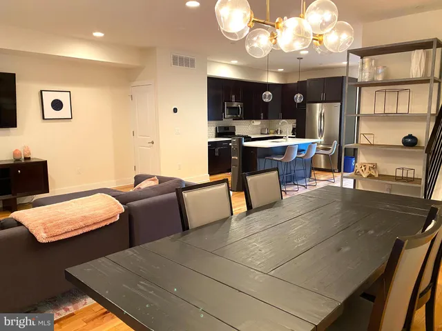 a bedroom with a bed and a table