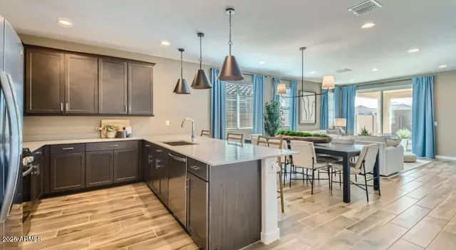 a kitchen with counter top space appliances and a center island