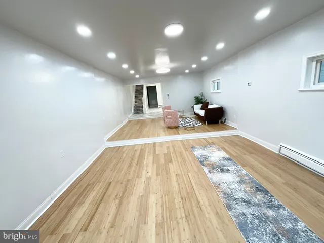 a view of a living room and a hard wood floor
