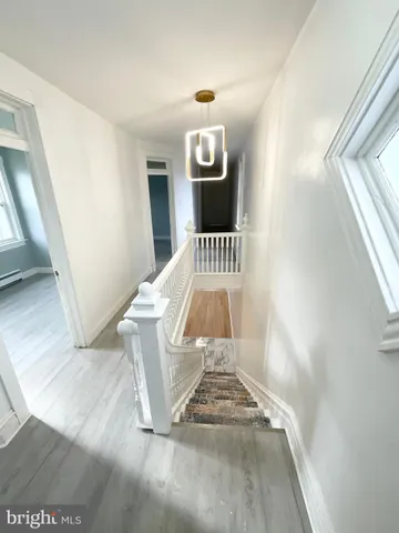 a view of entryway and kitchen