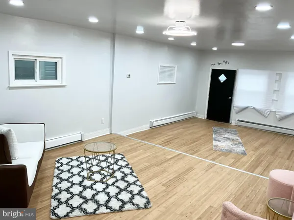 a bedroom with a bed and a lamp