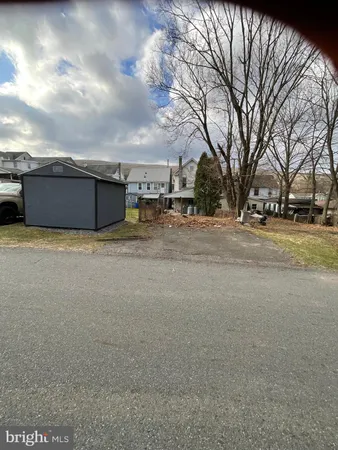 a view of a house with a snow in the yard