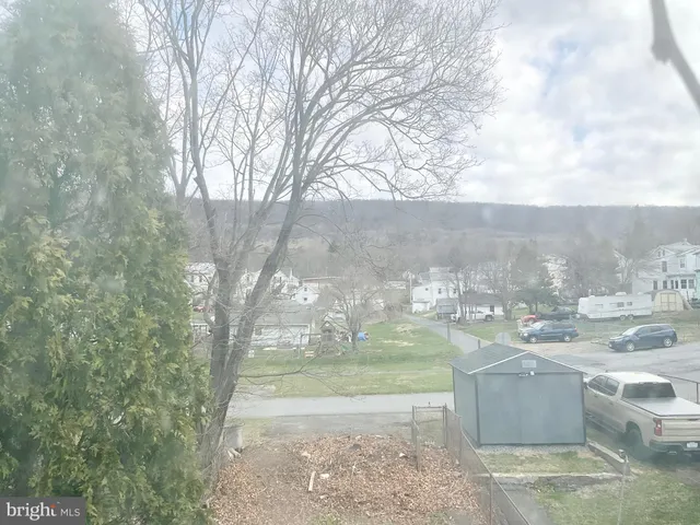 a view of a yard with an outdoor seating