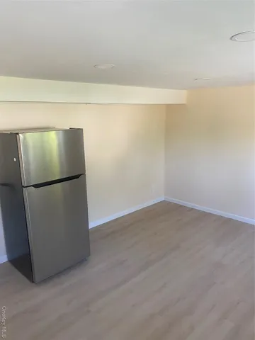 a view of a refrigerator in a kitchen
