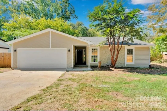 a house with trees in the background
