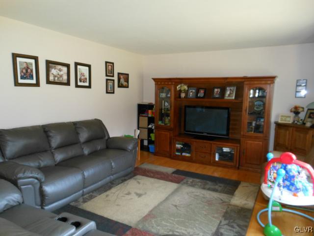 245 Maplewood Road Wind Gap, PA 18091 - Photo 12 of 15 a living room with furniture and a flat screen tv