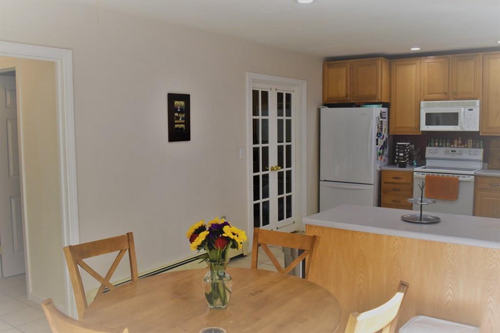 63 Streeter Road Sturbridge, MA 01518 - Photo 3 of 42 a living room with furniture a flat screen tv and a table