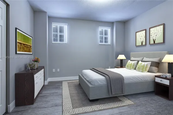 a bedroom with bed and window
