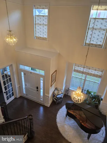 a kitchen with kitchen island granite countertop a sink a center island and stainless steel appliances