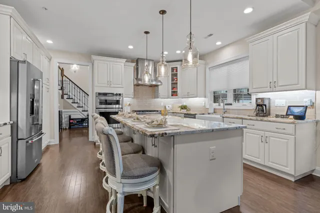 a view of a living room with hardwood floor and a window
