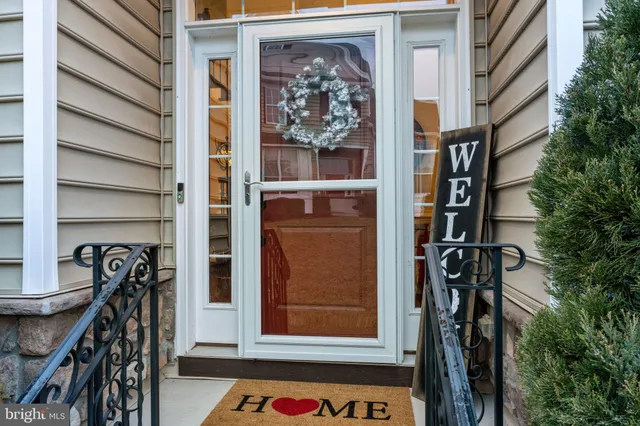 a front view of residential houses with yard