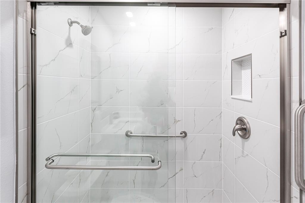 6020 Midnight Pass Road, Unit 30 Sarasota, FL 34242 - Photo 13 of 14 a bathroom with a shower