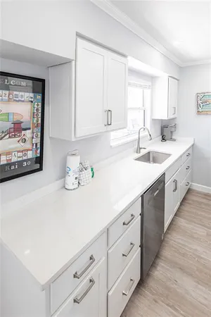 a spacious bathroom with a double vanity sink and a window