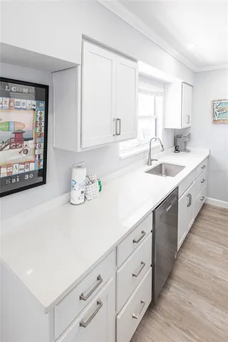 a spacious bathroom with a double vanity sink and a window