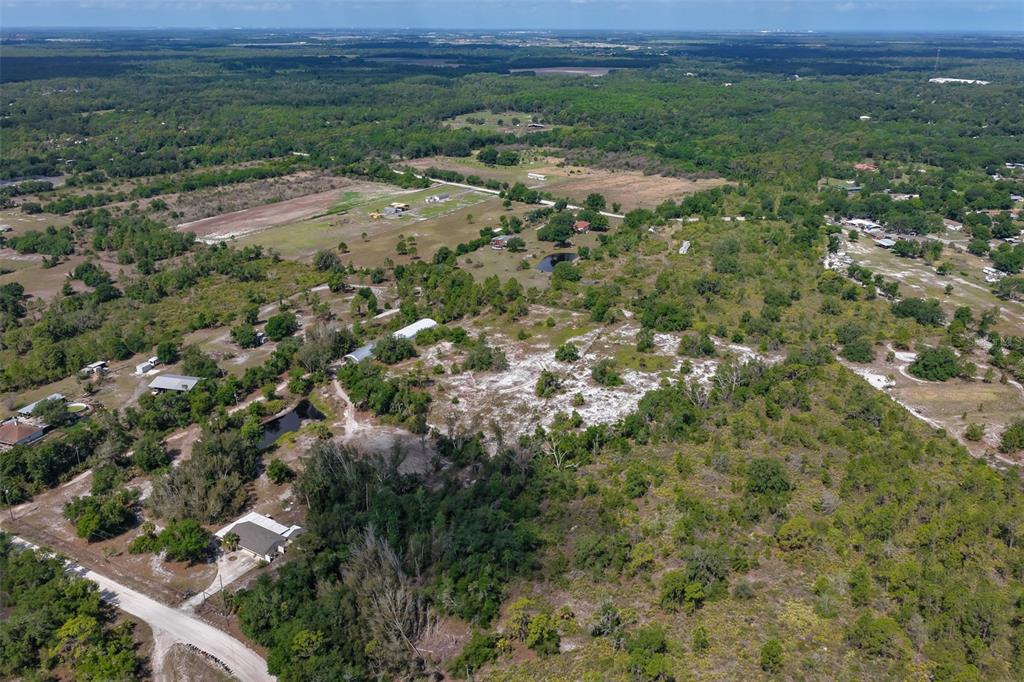14451 Highland Road Wimauma, FL 33598 - Photo 76 of 80 a view of a big yard with lots of green space
