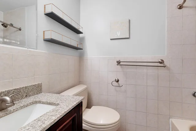a kitchen with a sink a table and chairs in it