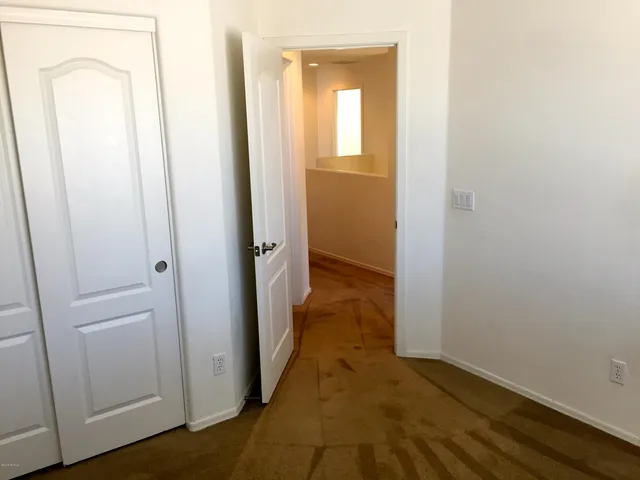 a view of a bathroom from a hallway