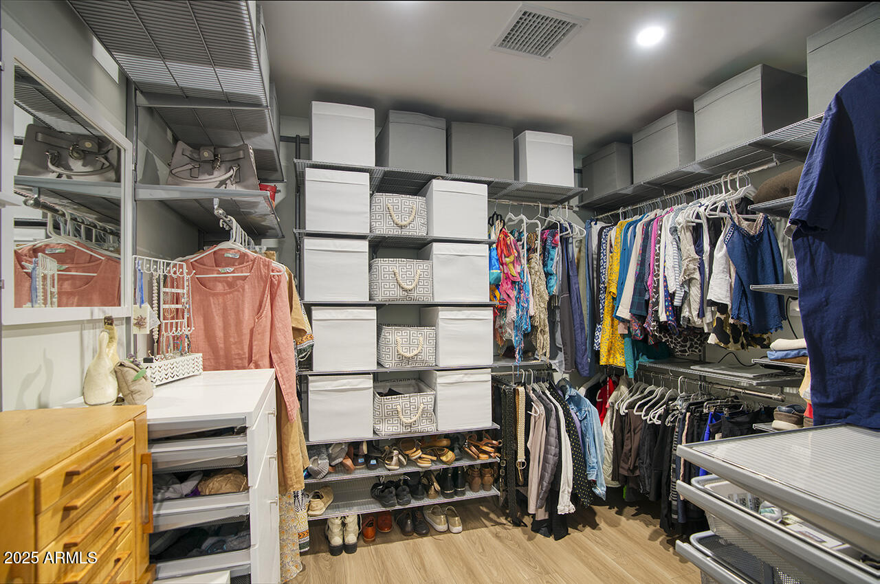 3337 East Las Rocas Drive Phoenix, AZ 85028 - Photo 16 of 22 a view of walk in closet with clothes and shoes