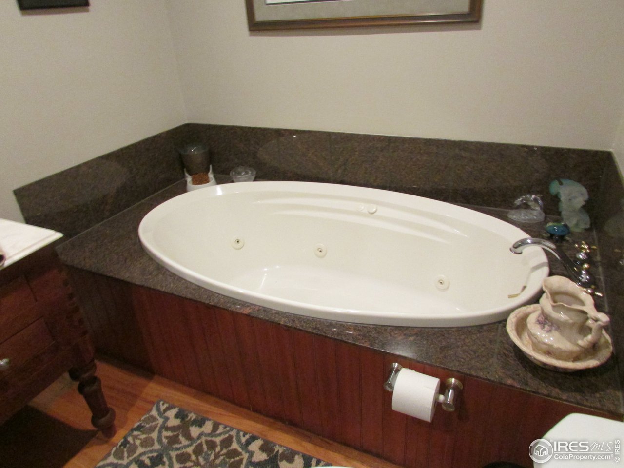 3669 County Road 45 Hudson, CO 80642 - Photo 13 of 25 a bathroom with a sink and a mirror