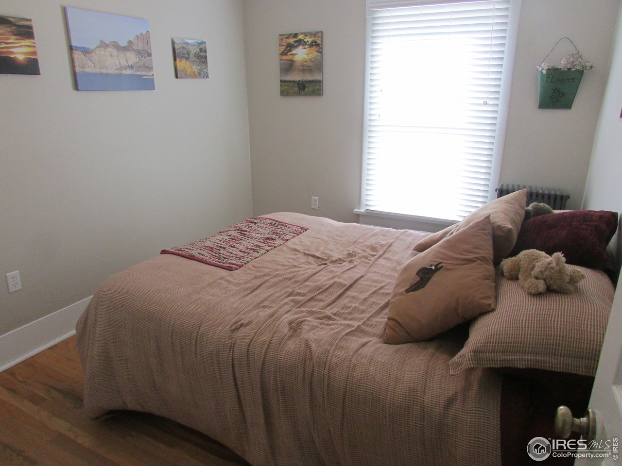 3669 County Road 45 Hudson, CO 80642 - Photo 15 of 25 a bedroom with a bed and a window