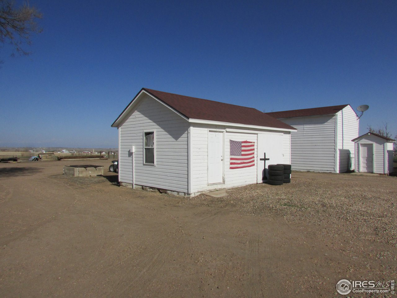 3669 County Road 45 Hudson, CO 80642 - Photo 20 of 25 a front view of a house with a yard