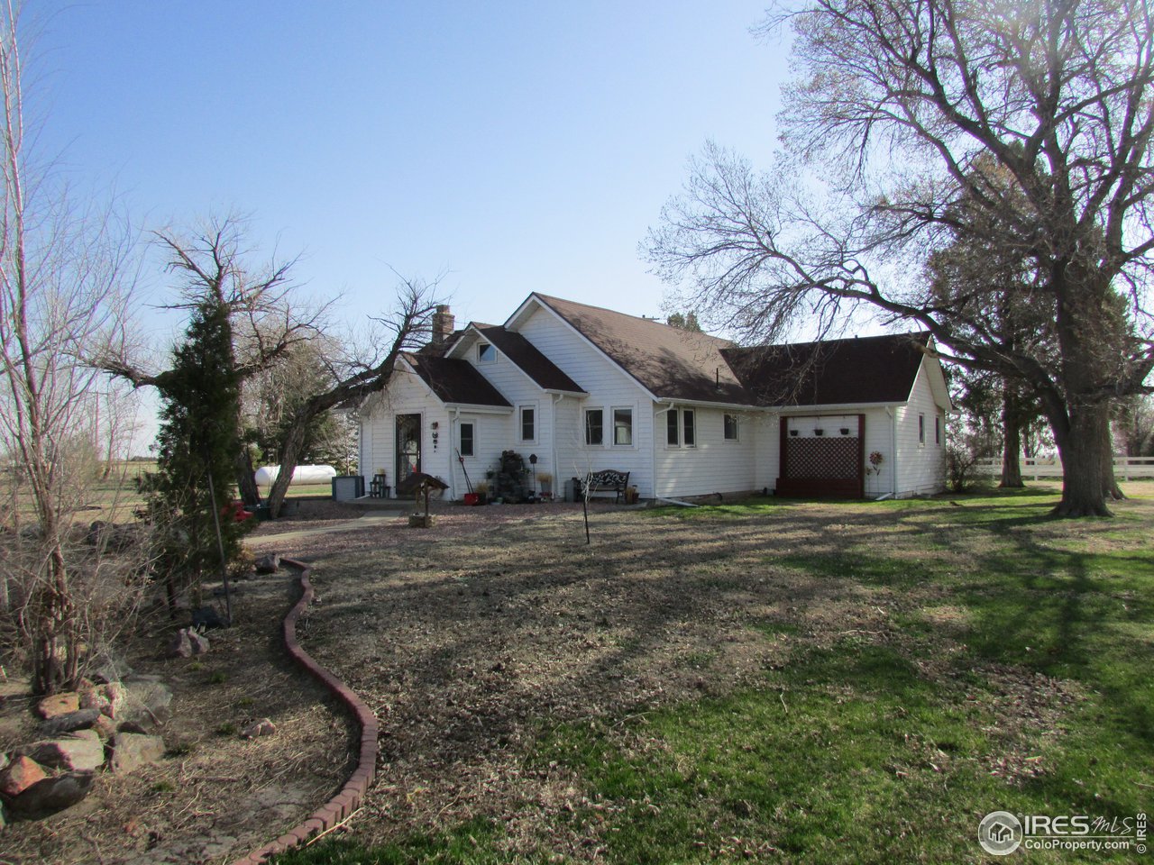 3669 County Road 45 Hudson, CO 80642 - Photo 4 of 25 a view of a house with a yard