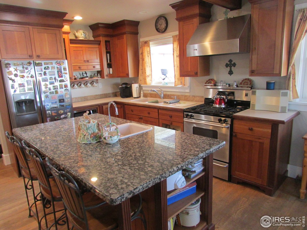 3669 County Road 45 Hudson, CO 80642 - Photo 5 of 25 a kitchen with granite countertop lots of counter top space and furniture