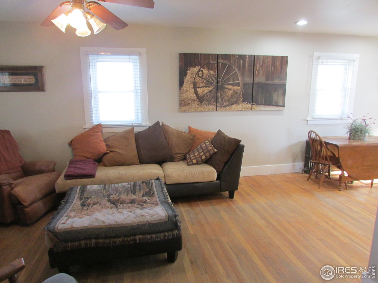 3669 County Road 45 Hudson, CO 80642 - Photo 7 of 25 a living room with furniture and a window