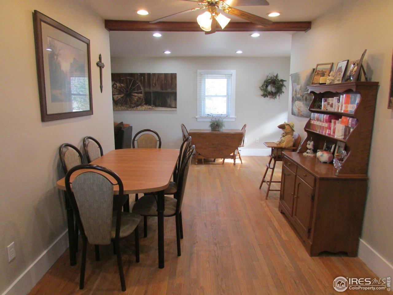 3669 County Road 45 Hudson, CO 80642 - Photo 8 of 25 a view of a dining room with furniture and wooden floor
