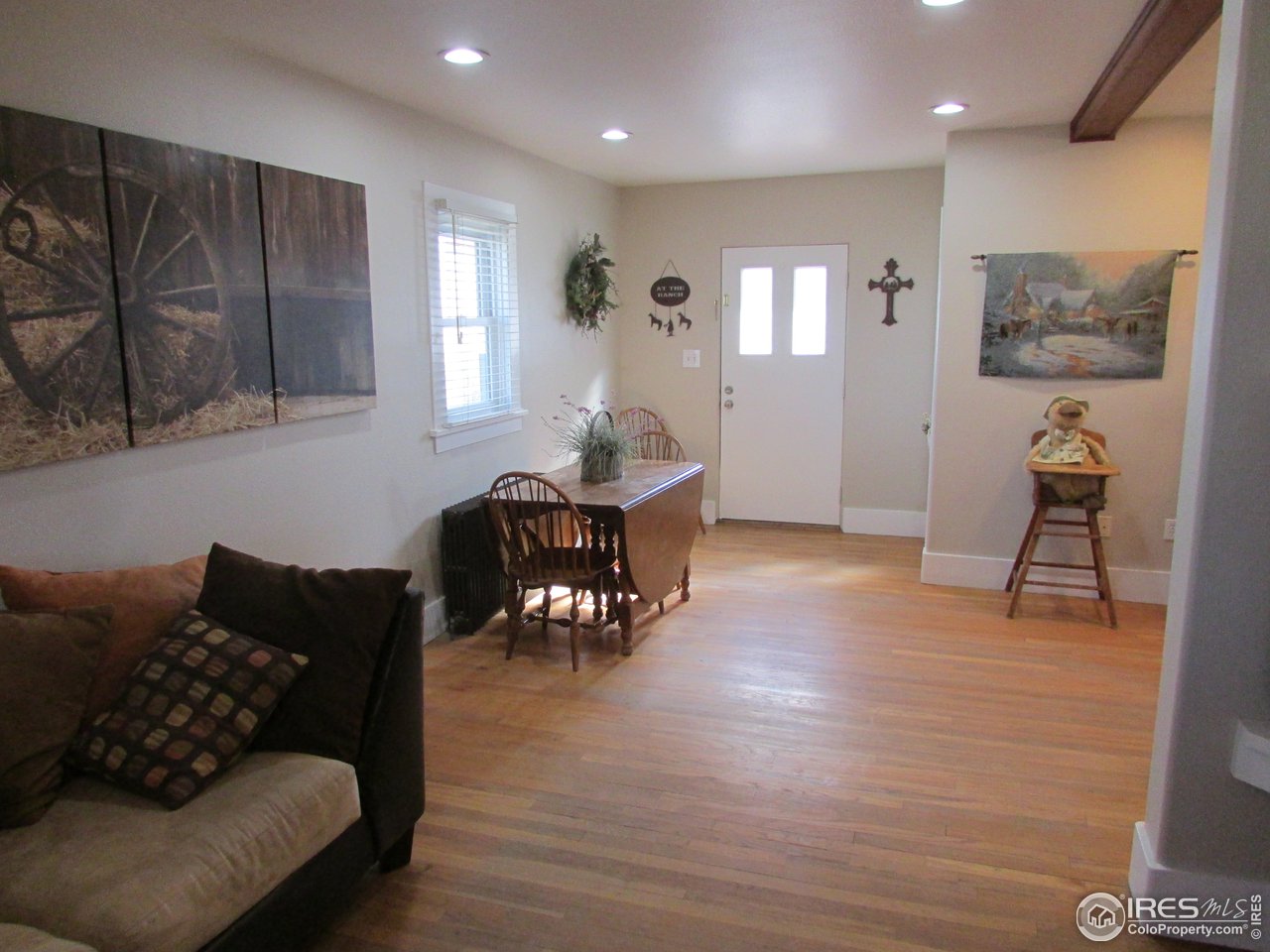 3669 County Road 45 Hudson, CO 80642 - Photo 10 of 25 a living room with furniture and wooden floor