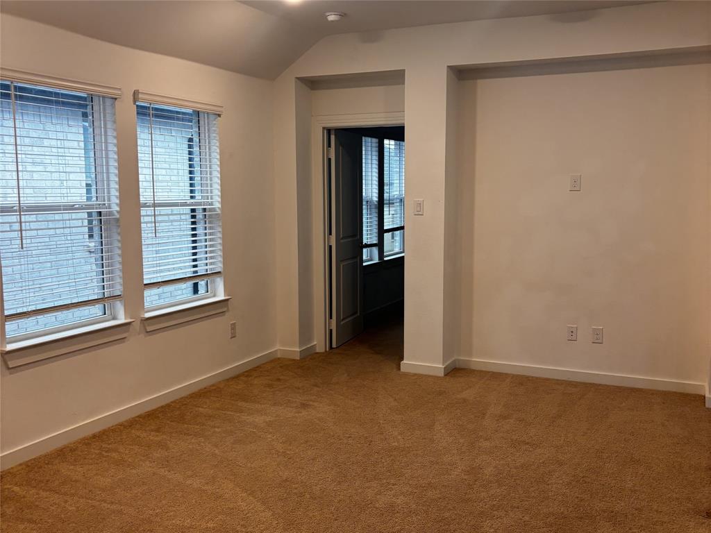 2828 Walden Road Celina, TX 75009 - Photo 19 of 30 Carpeted room featuring two windows with white blinds, recessed lighting, and a vaulted ceiling detail