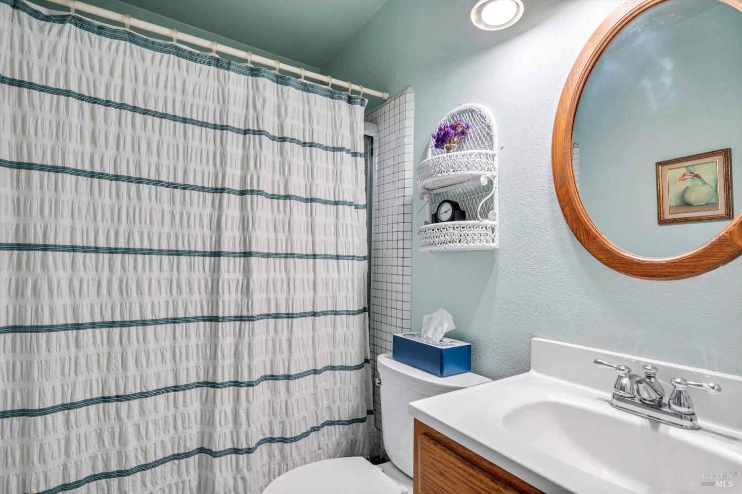 971 Eleanor Avenue Rohnert Park, CA 94928 - Photo 15 of 25 a bathroom with a sink and a mirror