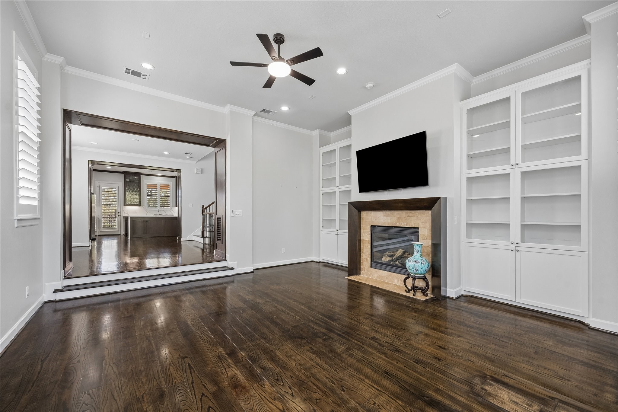 709 Herkimer Street Houston, TX 77007 - Photo 12 of 31 wooden floor fireplace and windows in a room