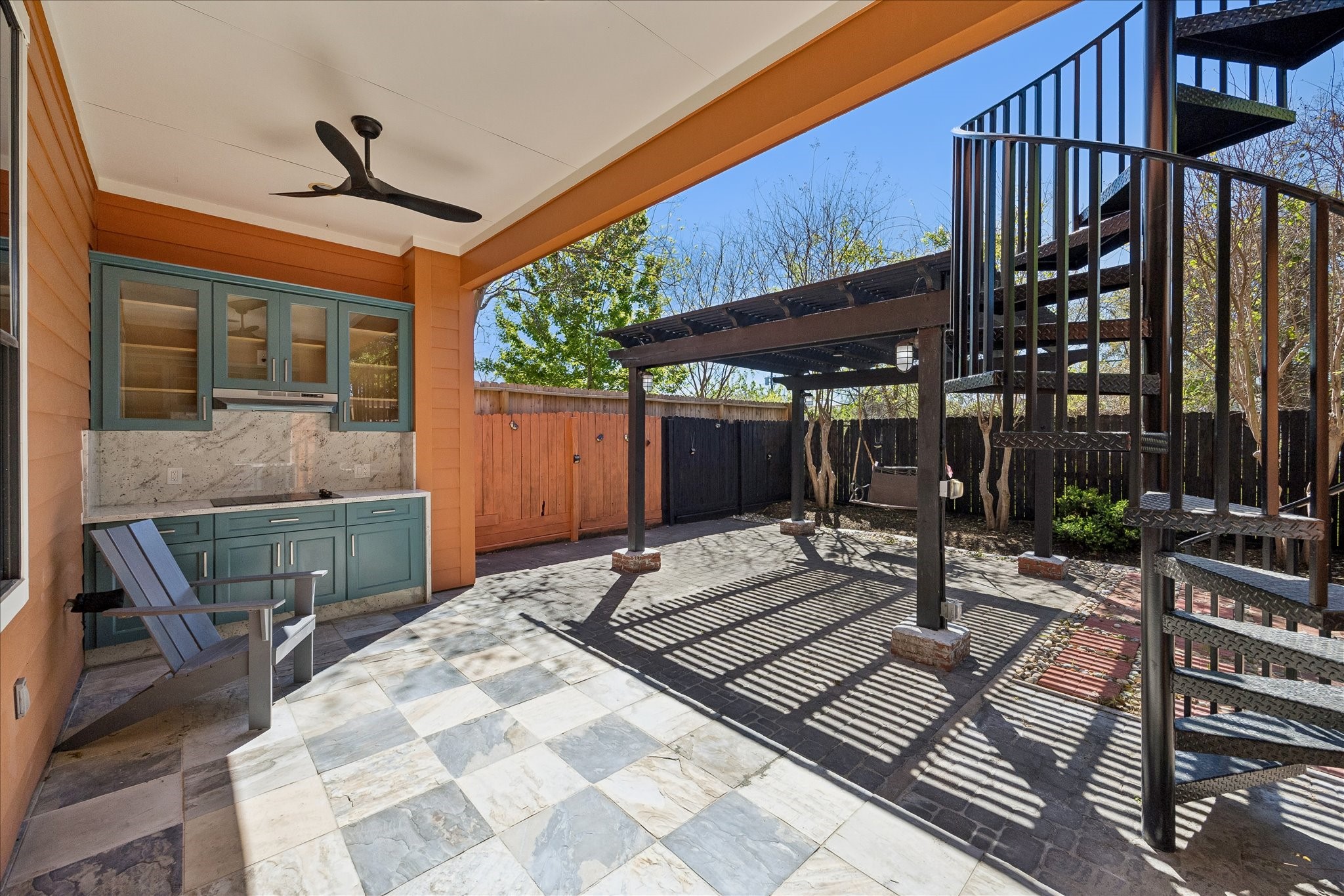 709 Herkimer Street Houston, TX 77007 - Photo 28 of 31 a backyard of a house with barbeque oven table and chairs
