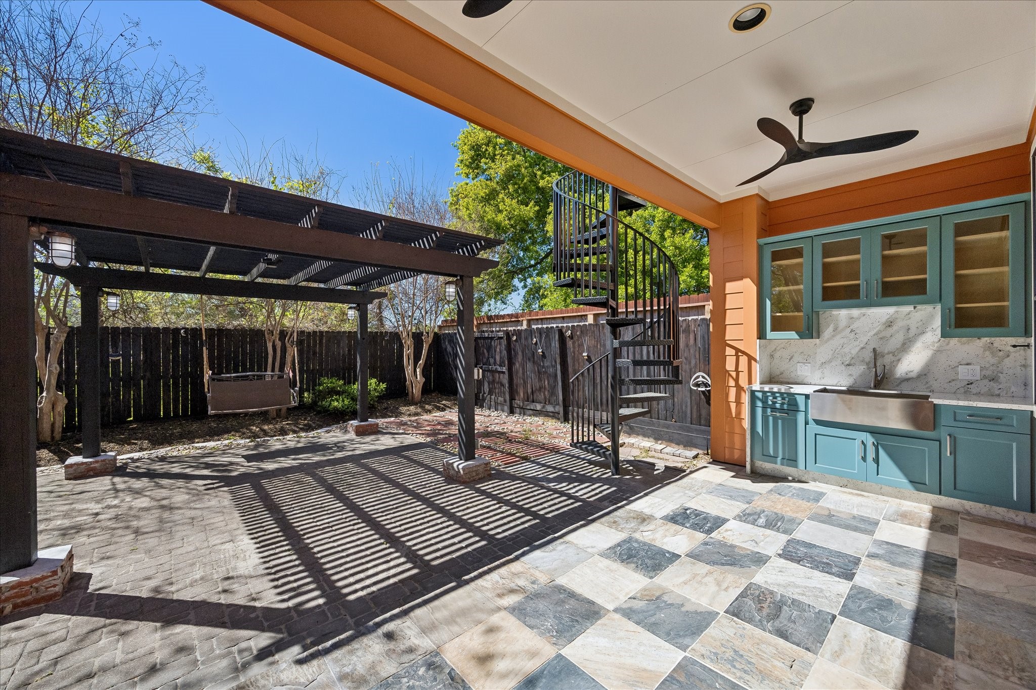 709 Herkimer Street Houston, TX 77007 - Photo 29 of 31 a backyard of a house with barbeque oven table and chairs