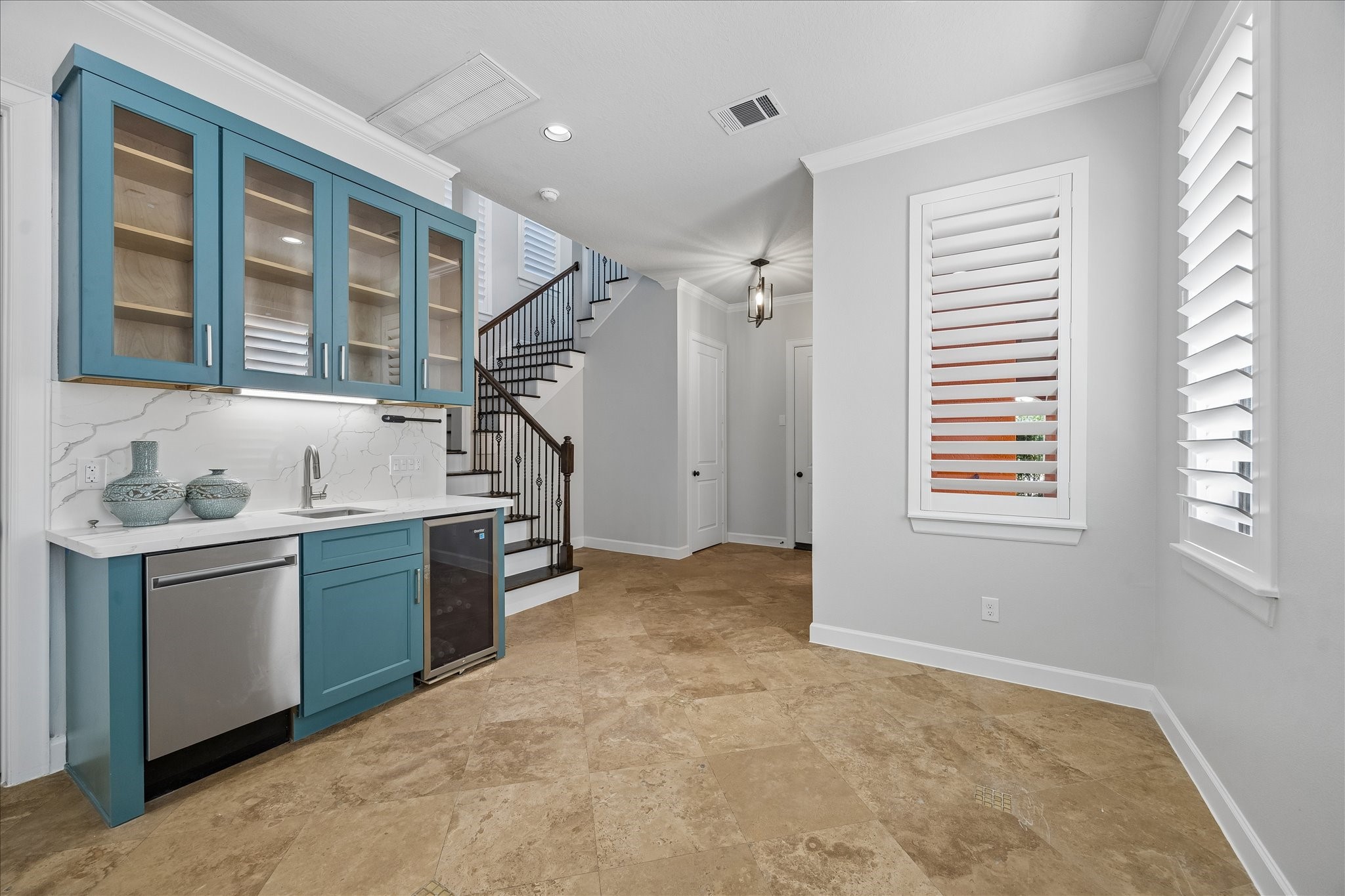 709 Herkimer Street Houston, TX 77007 - Photo 7 of 31 a kitchen with a sink cabinets and window