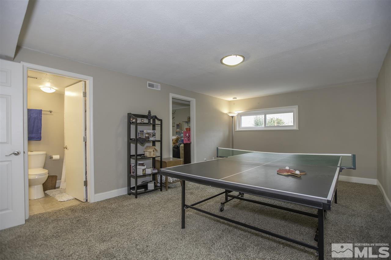 1055 Mark Allen Circle Reno, NV 89503 - Photo 17 of 27 a living room with furniture and a table