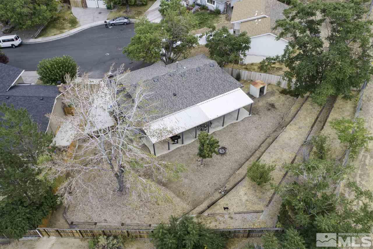 1055 Mark Allen Circle Reno, NV 89503 - Photo 23 of 27 an aerial view of a house with a yard