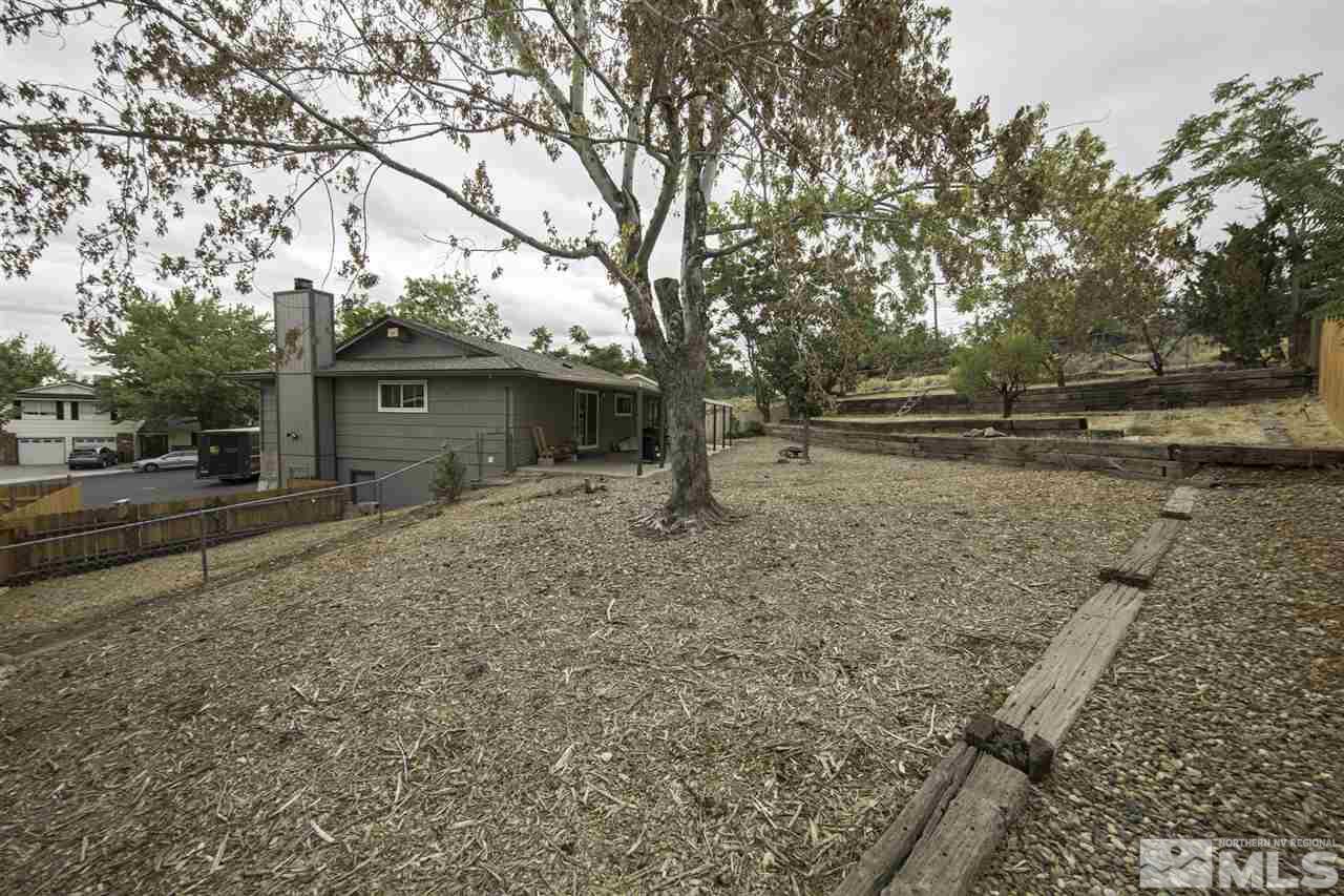 1055 Mark Allen Circle Reno, NV 89503 - Photo 27 of 27 a backyard of a house with lots of green space