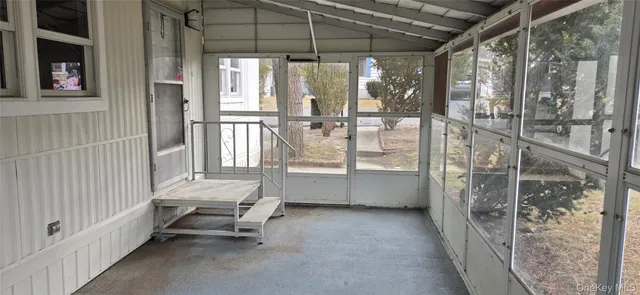 a room with sliding door and outdoor seating