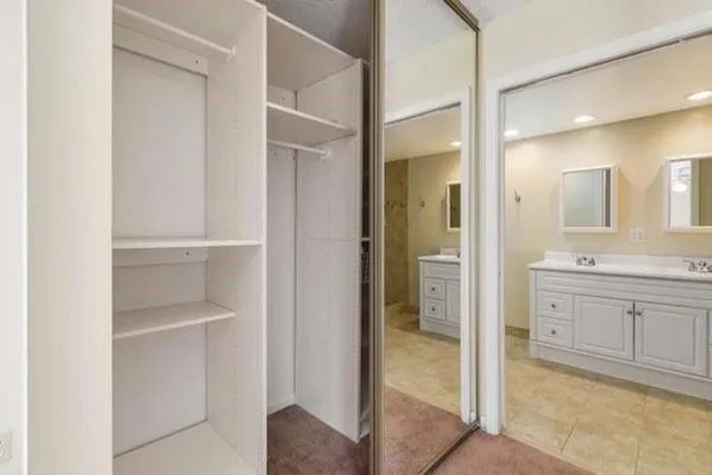 a spacious bathroom with a shower and a sink